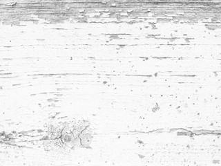 Fototapeta premium Wood texture with white flaked paint. Peeling paint on weathered wood. Old cracked paint pattern on rusty background. Chapped paint on an old wooden surface