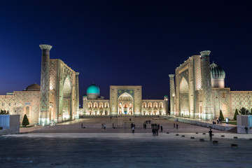Fototapeta na wymiar View of Registan square in Samarkand with Ulugbek madrassas, Sherdor madrassas and Tillya-Kari madrassas at night with backlight. Uzbekistan