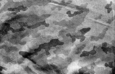 Dirty camouflage cloth with blur effect in black and white. © pavelalexeev