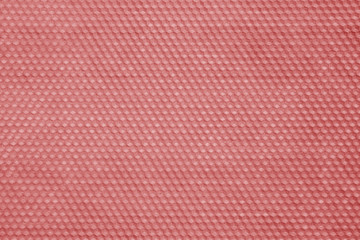 Honeycomb wax texture in red tone.