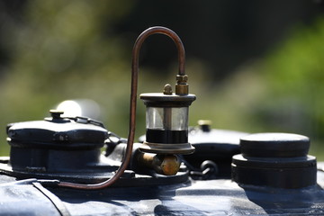 Partial view of an old tractor. Side view to the motor of an historical tractor.