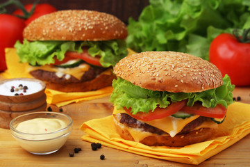 Two fresh hamburgers with vegetables	