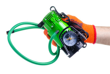 Pump car compressor in hand on white background isolation