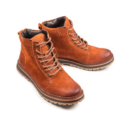 red suede boots on an isolated white background