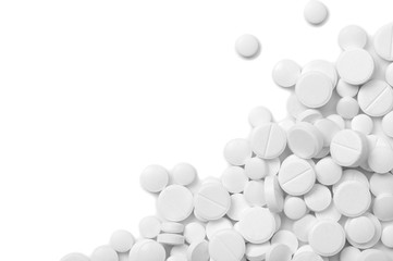 Heap of pills on white