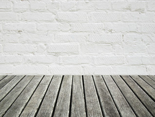 white brick wall and wood floor