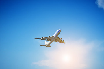 Airplane flying on blue sky background
