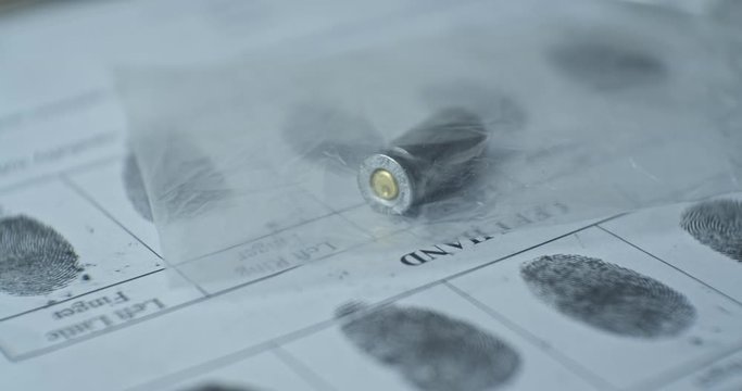 Bullet cartridge and fingerprints card. CSI