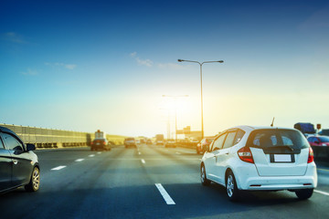 Car driving on highway road,car on road and sunset background,Transportation