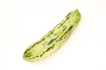 Summer harvest of vegetables concept. Zucchini on a light white background.