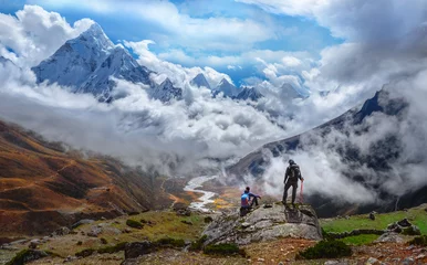 Peel and stick wall murals Ama Dablam Active hikers hiking, enjoying the view, looking at Himalaya mountains landscape.Tracking to Everest base camp valley with Ama Dablam view. Travel sport lifestyle concept