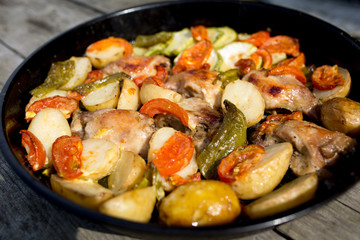 Tasty dinner on a dish. Fried chicken with vegetables.