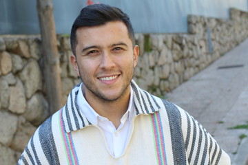 Obraz premium Good looking Hispanic man wearing a ruana 