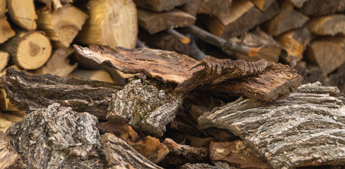  tree bark neatly stacked in a pile