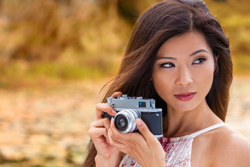 Asian Chinese Woman Girl Taking Photographs With Retro Style Camera