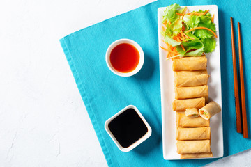 Chinese spring rolls on a white plate