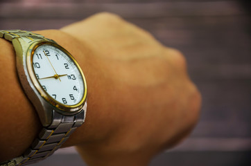 hand with a wrist watch, close-up.