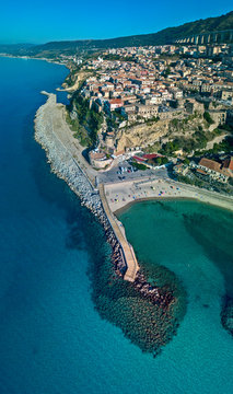 Aerial view of Pizzo Calabro, pier, castle, Calabria, tourism Italy. Panoramic view of the small town of Pizzo Calabro by the sea. Houses on the rock. On the cliff stands the Aragonese castle