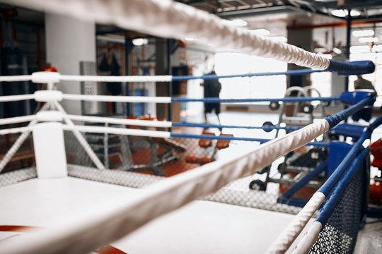 professional boxing ring . close up cropped photo. gym with modern interior. blurred foreground.empty gym