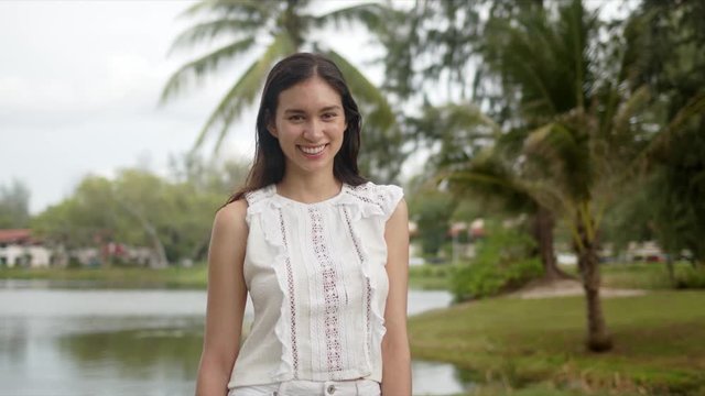 Satisfied young woman during tropical vacation