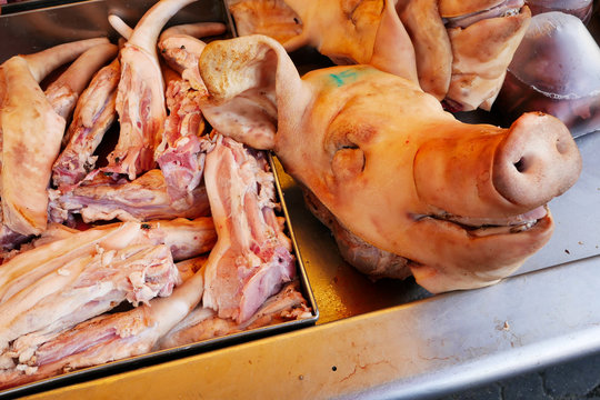A picture of a pig's head is put on the market.