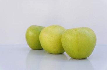 Green apples on white background. 