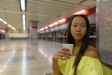 Young beautiful tourist woman exploring the city of Bangkok