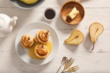 Sweet cooked pears on white table