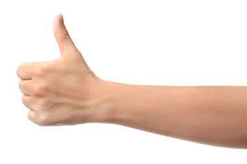 Hand of woman showing thumb-up gesture on white background