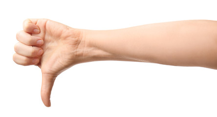 Hand of woman showing thumb-down gesture on white background