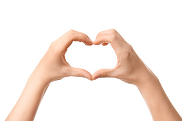 Hands of woman making heart shape on white background