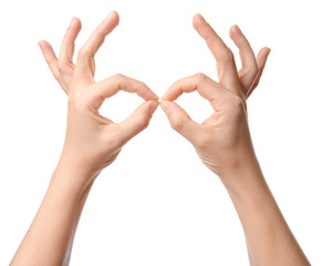 Hands of woman on white background