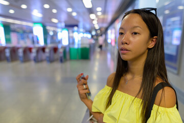 Young beautiful tourist woman exploring the city of Bangkok