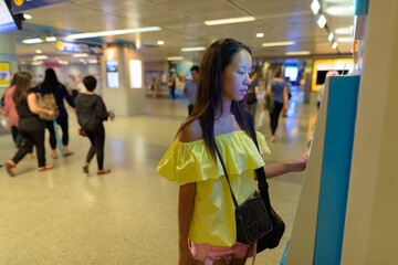 Young beautiful tourist woman exploring the city of Bangkok