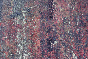Natural stone with red and black tones. Background, texture.
