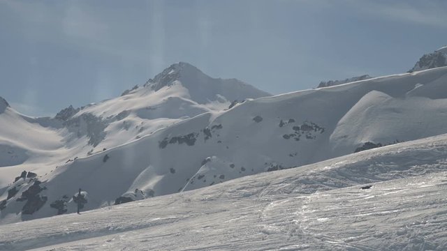 Video panorama of snowy Caucasus glacier mountains on a sunny day