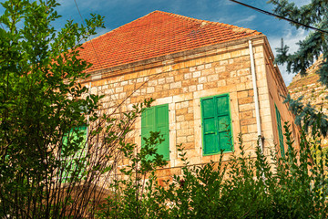 This is a capture of the old houses in Okaibeh a village Located in Lebanon and you can see in the picture the old architectural of stones with an historic walls and churches