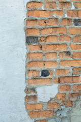 Texture of old cracked plastered brick wall.