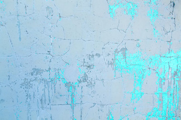 Obraz premium Texture of an old plastered wall painted with blue and white paint.