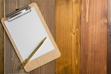 Blank paper to note on the wood floor