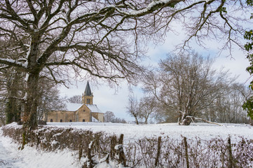 old church in winter snow landscape