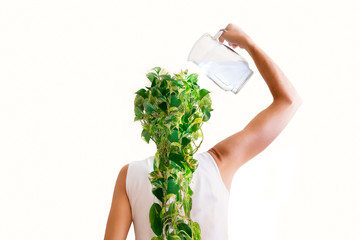 Woman watering a plant on her head. White background