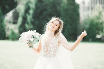 Bride holding big and beautiful wedding bouquet with flowers