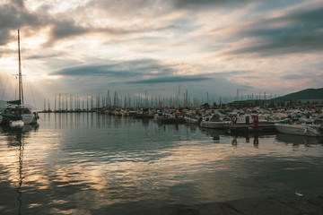 Fototapeta premium sunrise at a pier with boats