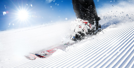 Winter ski sport activities in sunny day. Skier detail panorama or banner. Copy space concept.