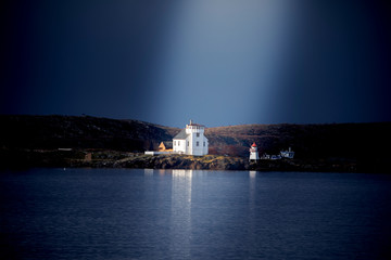 Fototapeta na wymiar Lighthouse on coast of Northern Norway