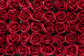 Burgundy rose flowers made from soap close-up background