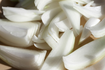 Pile of sliced white onion close up
