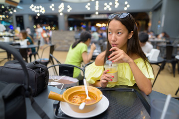 Young beautiful tourist woman exploring the city of Bangkok