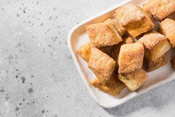 Cottage cheese cookies on a rectangular ceramic plate on a light gray background